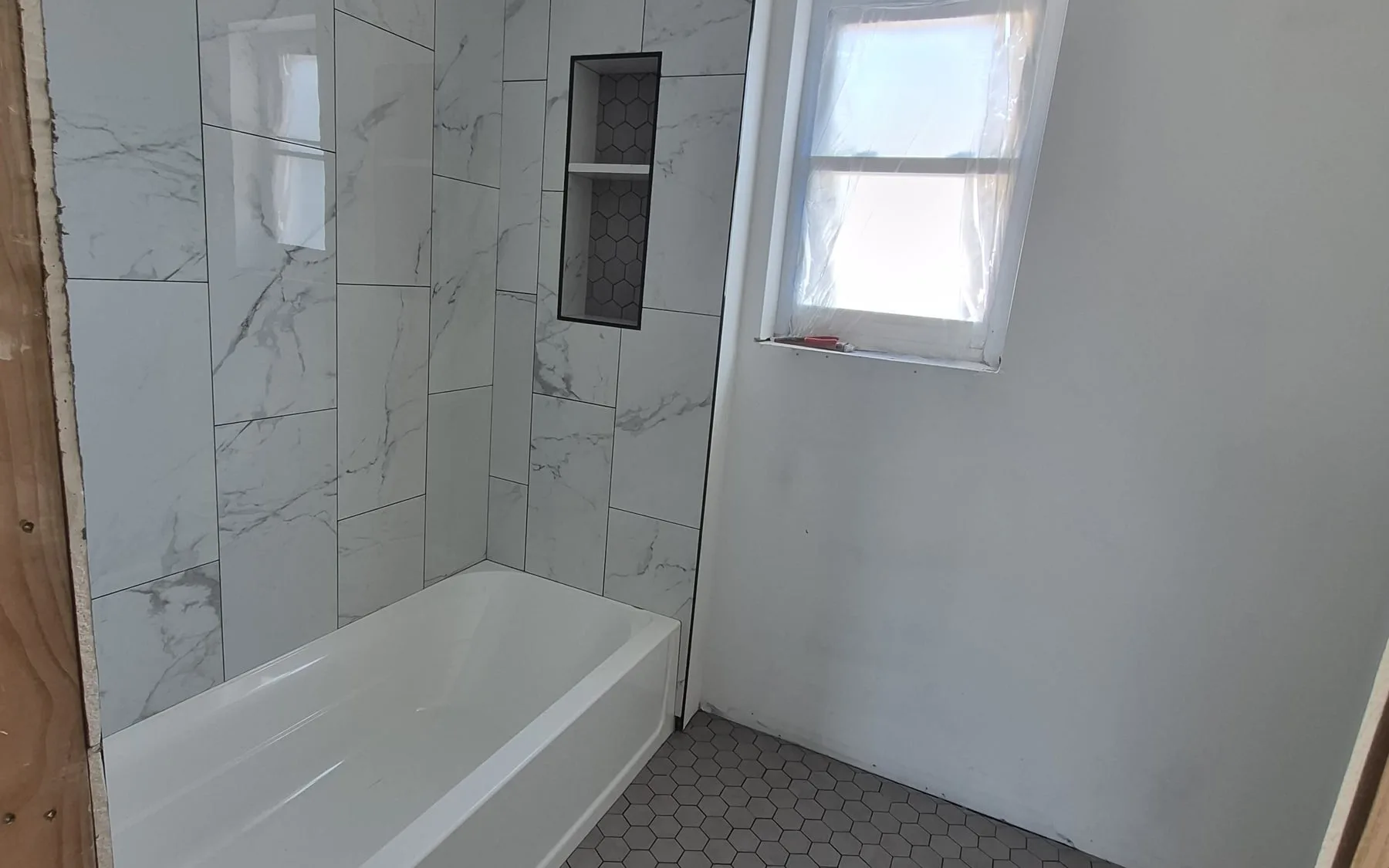 Premium bathroom remodel with custom tile and stone