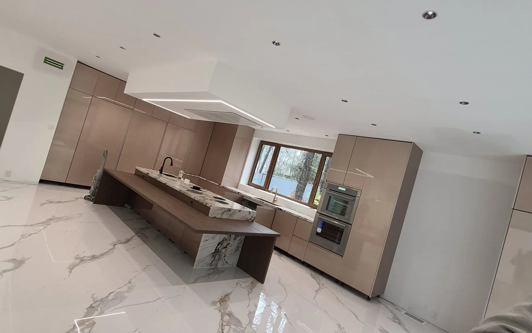 Brooklyn townhouse kitchen — custom rift-cut white oak cabinetry, marble waterfall island