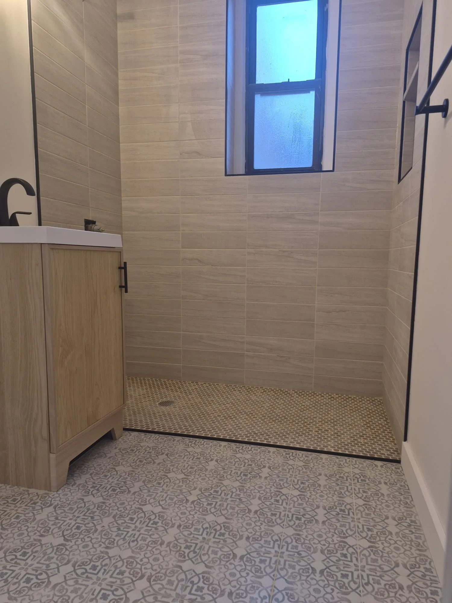 Custom tile detail in a Manhattan master bath